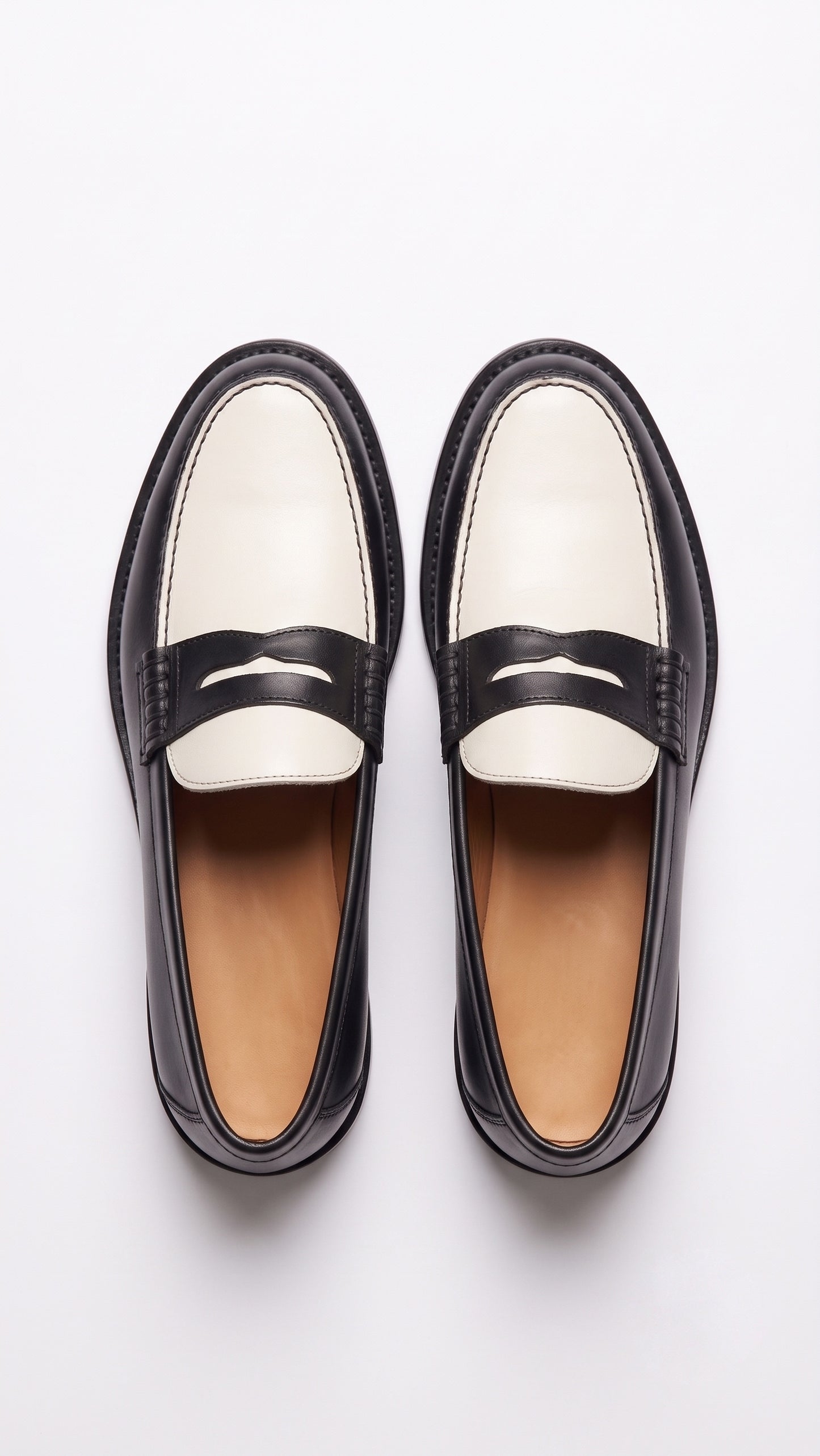 The Venice Two-Tone Penny Loafers in Noir Black & Ivory
