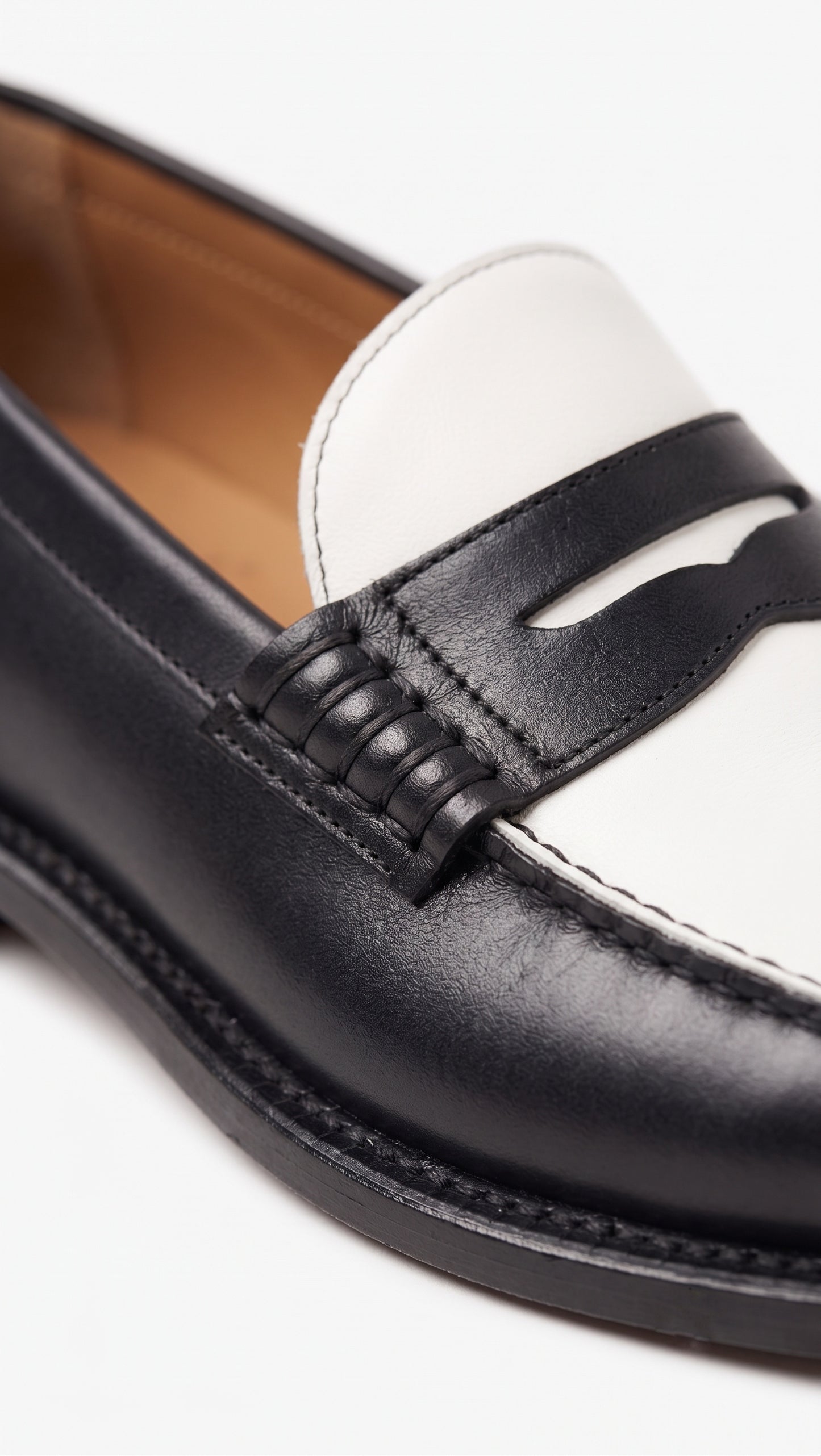 The Venice Two-Tone Penny Loafers in Noir Black & Ivory