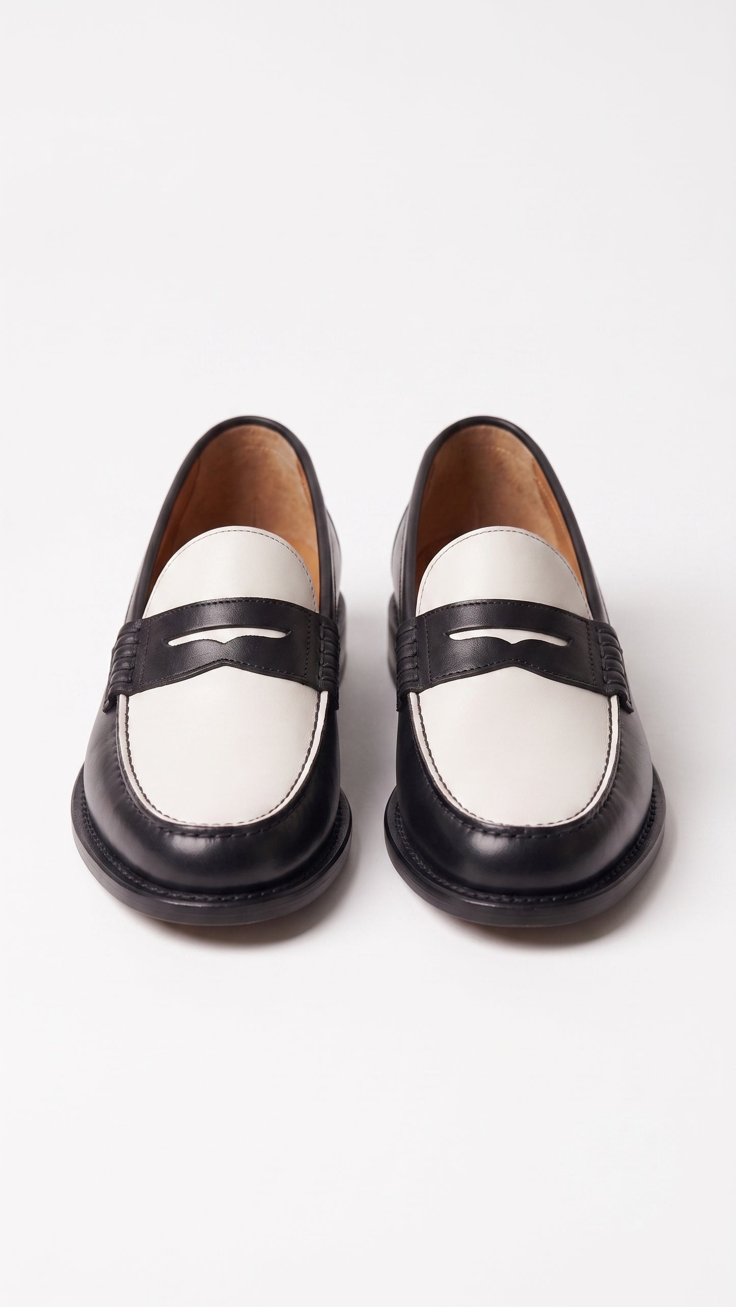 The Venice Two-Tone Penny Loafers in Noir Black & Ivory